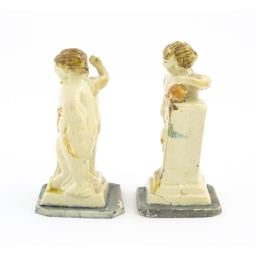 70 - A pair of English creamware pottery Classical figures with column detail. Approx. 4 3/4