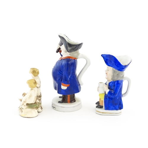 71 - Three assorted ceramic figures to include a Toby / character jug modelled as a seated man wearing a ... 