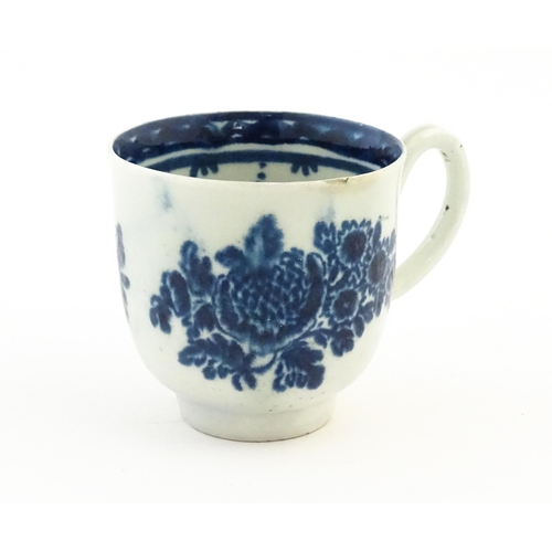 78 - A John Pennington Liverpool blue and white coffee cup decorated in the Peony and Daisy pattern with ... 