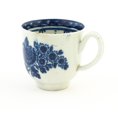 78 - A John Pennington Liverpool blue and white coffee cup decorated in the Peony and Daisy pattern with ... 