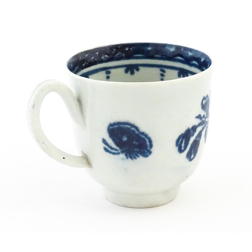 78 - A John Pennington Liverpool blue and white coffee cup decorated in the Peony and Daisy pattern with ... 