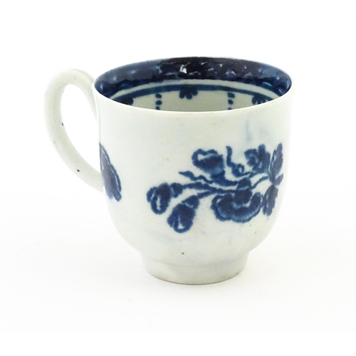 78 - A John Pennington Liverpool blue and white coffee cup decorated in the Peony and Daisy pattern with ... 