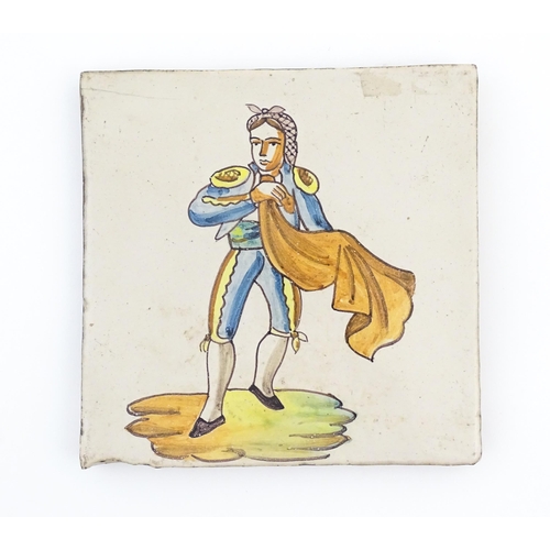 83 - A pair of Spanish tiles with hand painted bullfighter decoration, one depicting a picador, the other... 