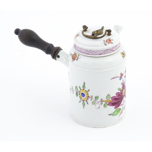 88 - A Continental chocolate pot and cover of cylindrical form with side spout and turned wooden handle, ... 