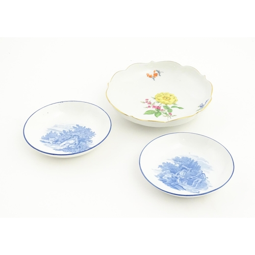 93 - A Continental dessert plate with hand painted flower detail, marked under with Meissen style crossed... 