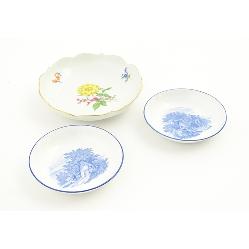 93 - A Continental dessert plate with hand painted flower detail, marked under with Meissen style crossed... 