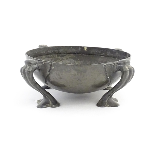 1009 - A Liberty & Co. Tudric pewter bowl of circular form raised on four Art Nouveau scrolled supports, de... 