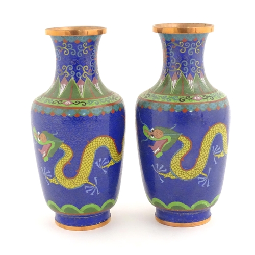 1026 - A pair of Oriental cloisonne vases decorated with two dragons and a flaming pearl amongst stylised c... 