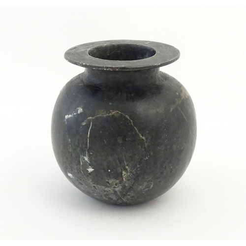 1029 - An Oriental soapstone vase of bulbous form. Approx. 5 1/4