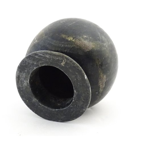 1029 - An Oriental soapstone vase of bulbous form. Approx. 5 1/4