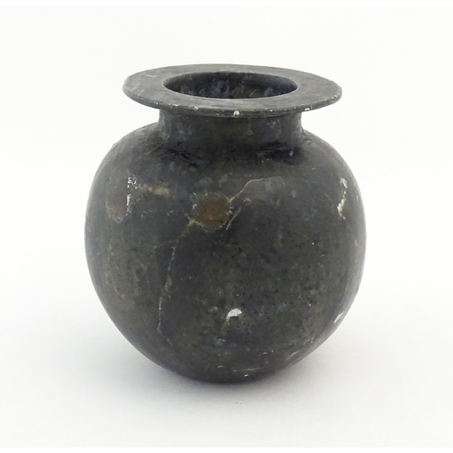 1029 - An Oriental soapstone vase of bulbous form. Approx. 5 1/4