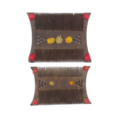 1033 - Two wooden shaped and double sided combs with pierced and thread detail. Largest approx. 5 1/2