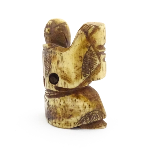 1038 - An Oriental carved bone netsuke modelled as a seated man holding a vase. Approx. 1 1/2