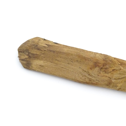 1079 - A naive carved wooden spoon. Approx. 20