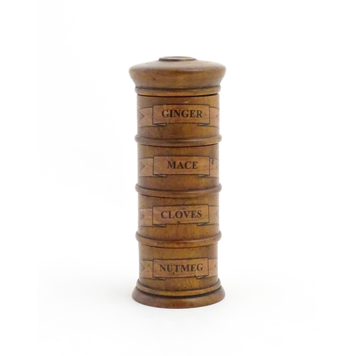 1082 - A four tier treen spice tower labelled Ginger, Mace, Cloves, and Nutmeg. Approx. 7 1/2