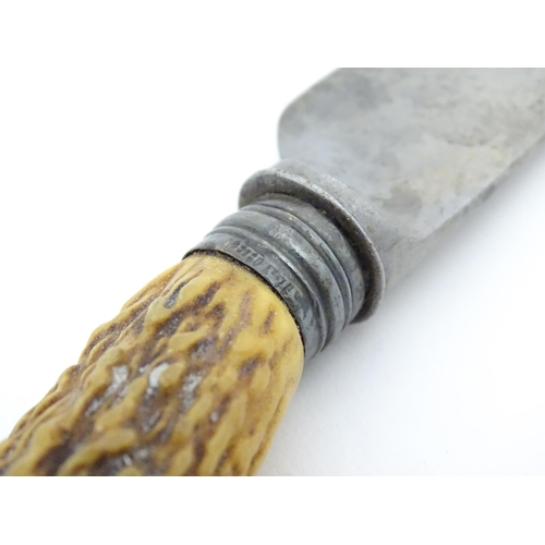 1083 - A Victorian carving knife and fork with antler handles and silver collar. Together with an antler ha... 