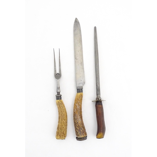 1083 - A Victorian carving knife and fork with antler handles and silver collar. Together with an antler ha... 