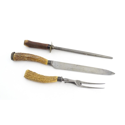 1083 - A Victorian carving knife and fork with antler handles and silver collar. Together with an antler ha... 