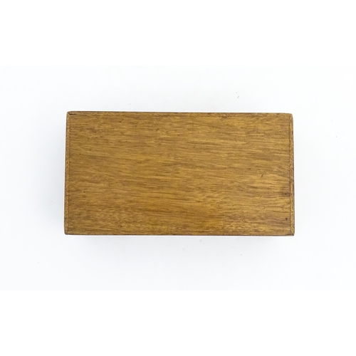 1139 - A 20thC table top cigarette box with burr veneers. Approx. 2 1/4