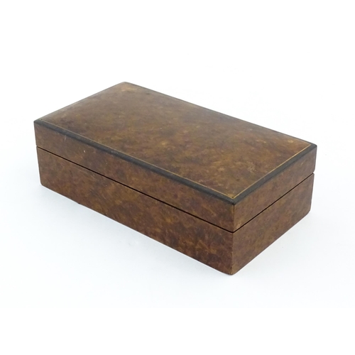 1139 - A 20thC table top cigarette box with burr veneers. Approx. 2 1/4