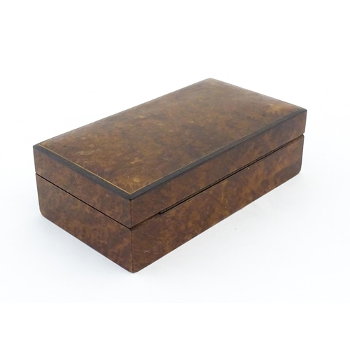 1139 - A 20thC table top cigarette box with burr veneers. Approx. 2 1/4