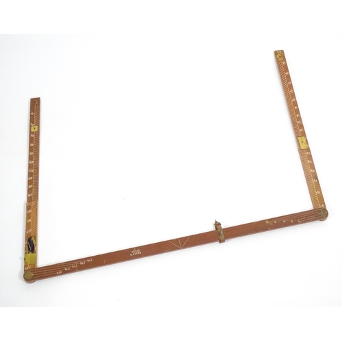 1150 - An M.D.S. Ltd. surveyor's folding triangle rule with inset spirit level and plumb bob. No. B.49645. ... 