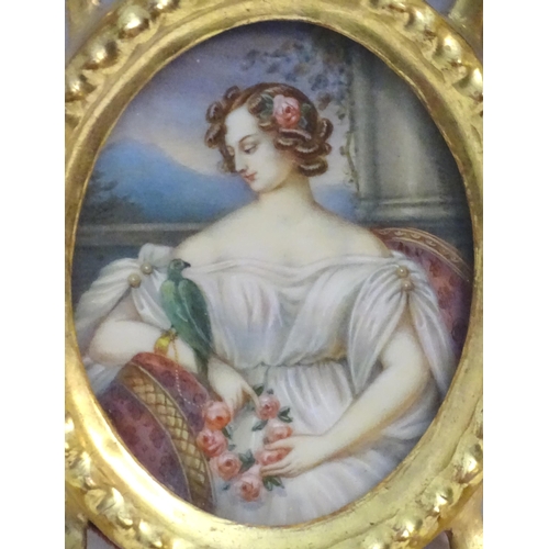 1156 - A 20thC oval watercolour portrait miniature depicting a seated maiden with a wreath of flowers and a... 