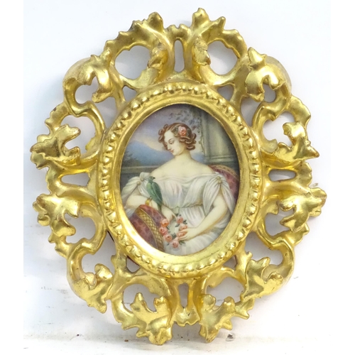 1156 - A 20thC oval watercolour portrait miniature depicting a seated maiden with a wreath of flowers and a... 