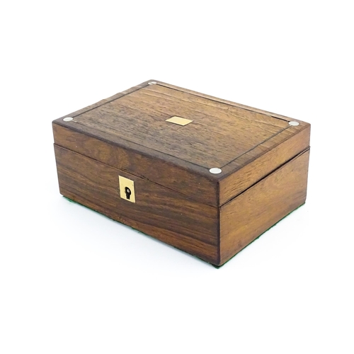 1164 - A 20thC rosewood jewellery box with inlaid brass and mother of pearl detail, the hinged lid opening ... 