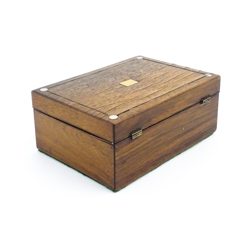 1164 - A 20thC rosewood jewellery box with inlaid brass and mother of pearl detail, the hinged lid opening ... 