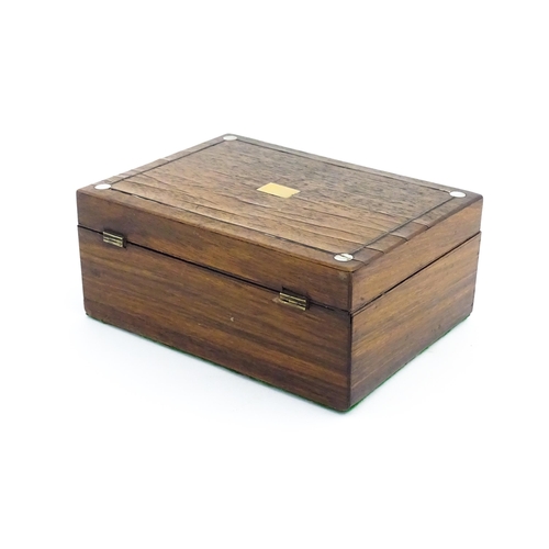 1164 - A 20thC rosewood jewellery box with inlaid brass and mother of pearl detail, the hinged lid opening ... 