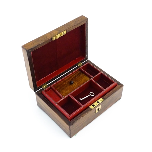 1164 - A 20thC rosewood jewellery box with inlaid brass and mother of pearl detail, the hinged lid opening ... 