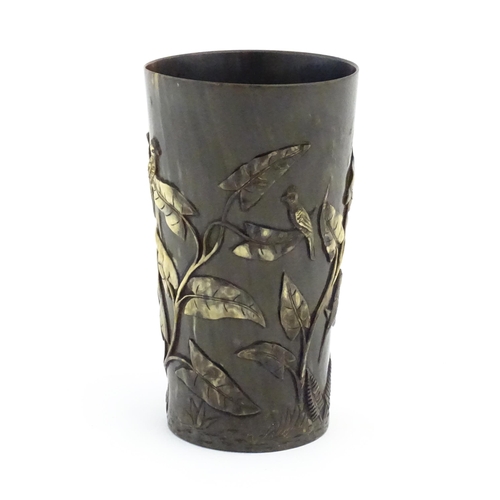 1171 - A late 19th / early 20thC horn beaker with carved decoration depicting parrot birds, ferns, foliage ... 