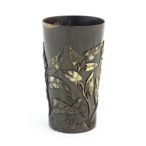 1171 - A late 19th / early 20thC horn beaker with carved decoration depicting parrot birds, ferns, foliage ... 