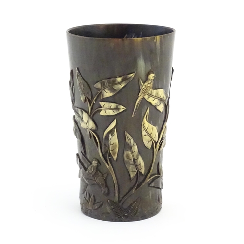 1171 - A late 19th / early 20thC horn beaker with carved decoration depicting parrot birds, ferns, foliage ... 