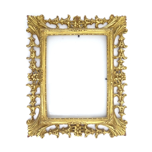 1233 - A 20thC Florentine style pierced giltwood frame. Approx. 13 1/2