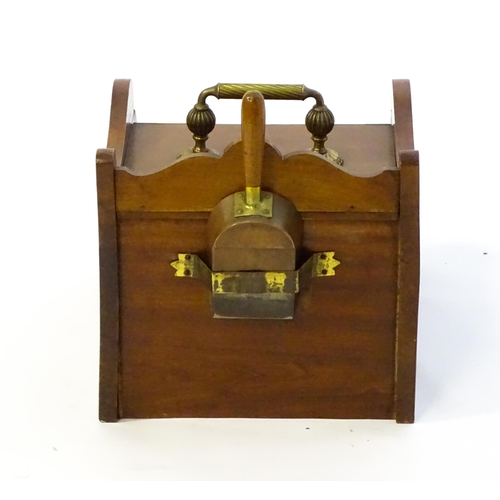 1262 - An early 20thC mahogany coal scuttle with a gadrooned handle above a fall front with an embossed bra... 