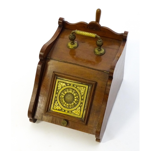 1262 - An early 20thC mahogany coal scuttle with a gadrooned handle above a fall front with an embossed bra... 