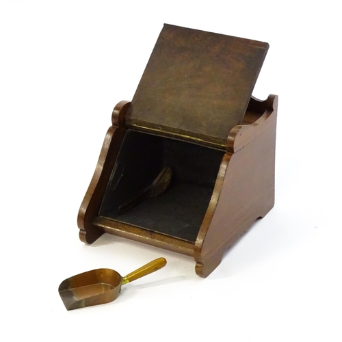 1262 - An early 20thC mahogany coal scuttle with a gadrooned handle above a fall front with an embossed bra... 