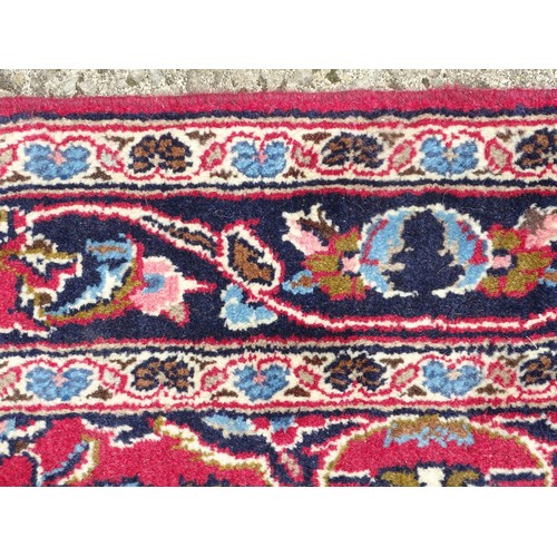 1273 - Carpet / Rug: A Central Persian kashan runner, the red ground with blue and cream ground motifs, flo... 