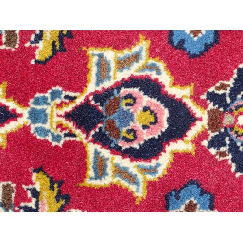 1273 - Carpet / Rug: A Central Persian kashan runner, the red ground with blue and cream ground motifs, flo... 