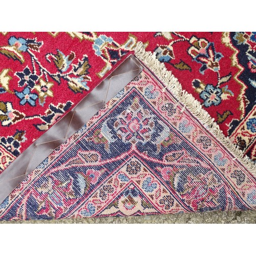 1273 - Carpet / Rug: A Central Persian kashan runner, the red ground with blue and cream ground motifs, flo... 