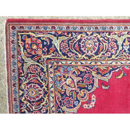 1275 - Carpet / Rug : A Central Persian Kashan Rug the red ground with central vignette having floral and f... 