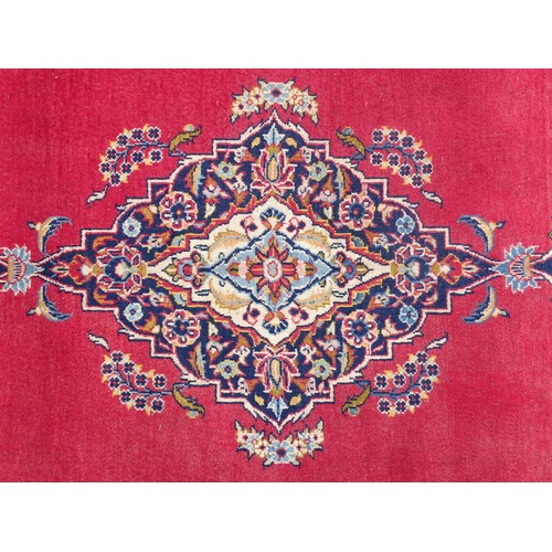 1275 - Carpet / Rug : A Central Persian Kashan Rug the red ground with central vignette having floral and f... 