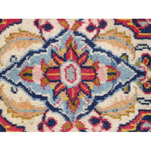 1275 - Carpet / Rug : A Central Persian Kashan Rug the red ground with central vignette having floral and f... 