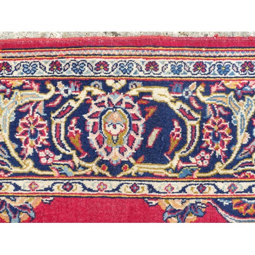 1275 - Carpet / Rug : A Central Persian Kashan Rug the red ground with central vignette having floral and f... 