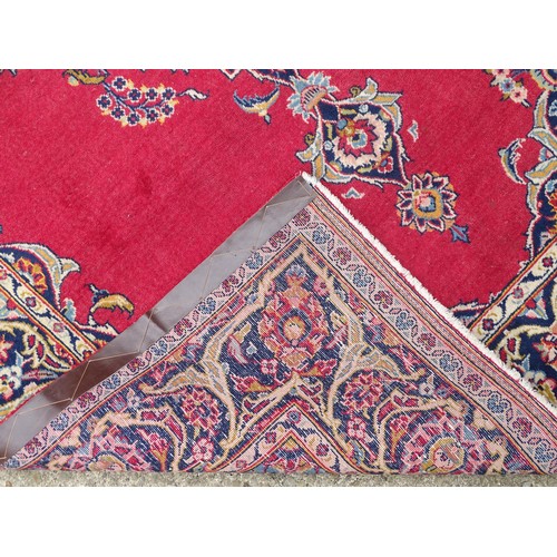 1275 - Carpet / Rug : A Central Persian Kashan Rug the red ground with central vignette having floral and f... 