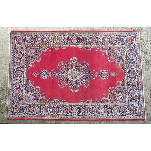 1275 - Carpet / Rug : A Central Persian Kashan Rug the red ground with central vignette having floral and f... 