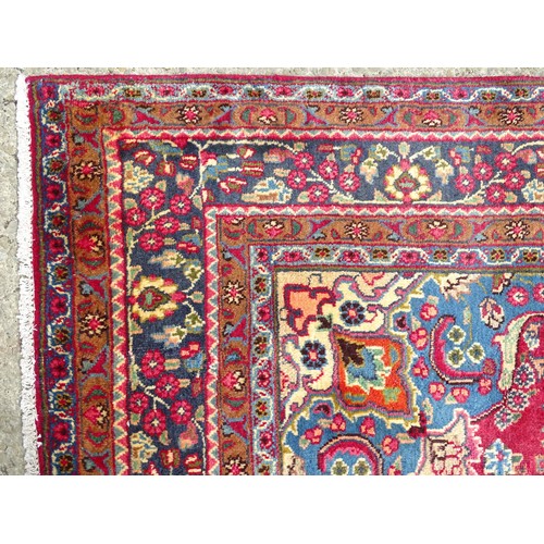 1277 - Carpet / Rug : A  North East Persian Meshed carpet, the red ground with central medallion having flo... 