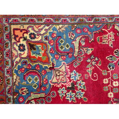 1277 - Carpet / Rug : A  North East Persian Meshed carpet, the red ground with central medallion having flo... 